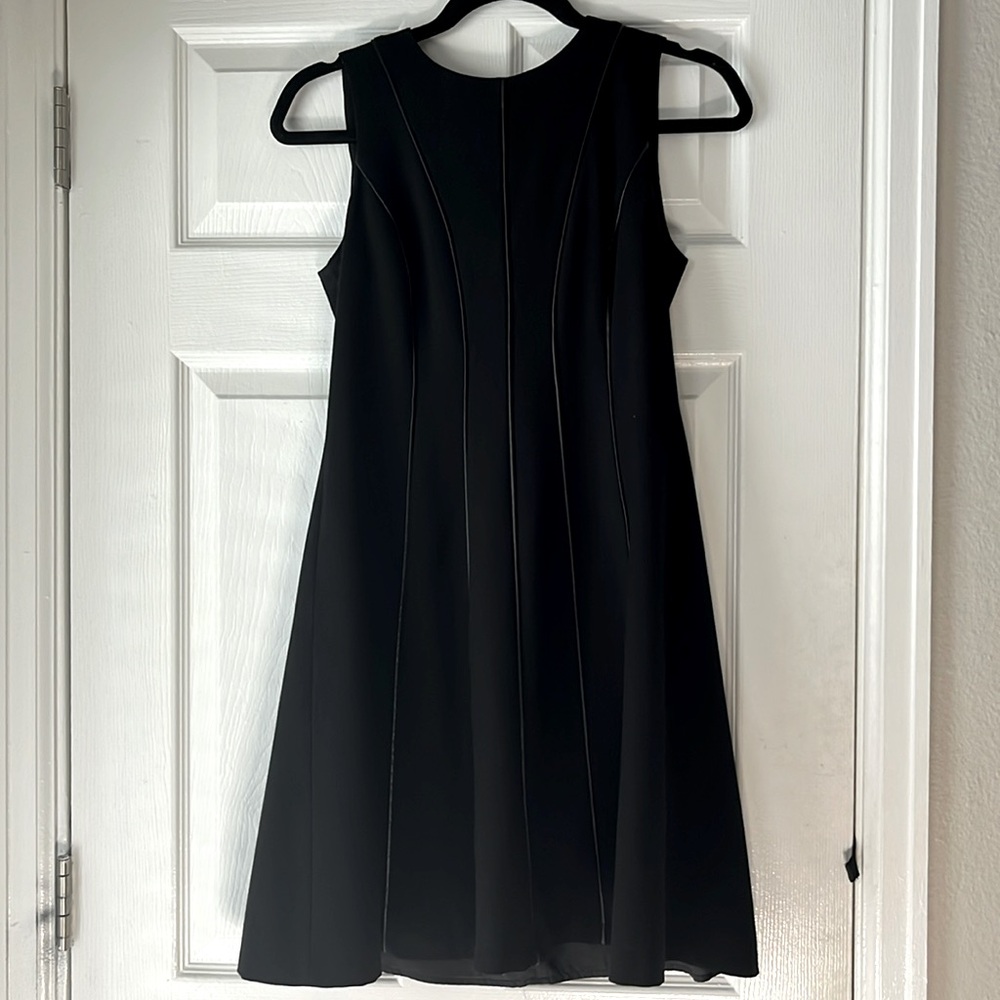 Calvin Klein super flattering  Fit and Flare black dress. Size 4P.